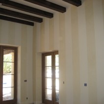 Gold wax stripes on master bedroom walls
